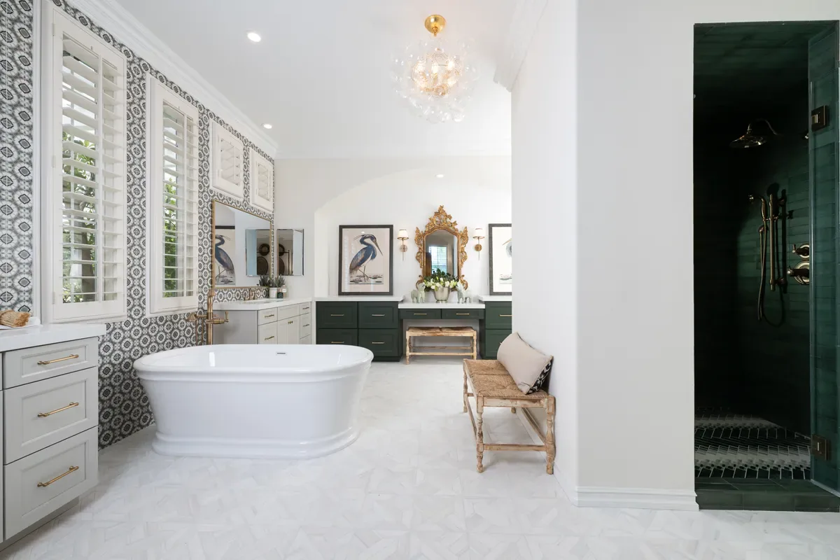 Primary bathroom renovation with a freestanding tub, chandelier and emerald tiled shower in Gwinnett County, GA