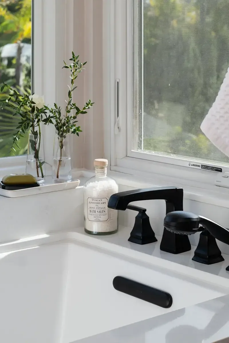 Undermount sink and matte black faucet detail in a completed Lawrenceville, GA bathroom remodel