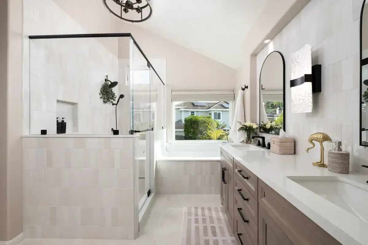 Primary bathroom remodel with a half-wall glass shower and long double vanity near Buford, GA