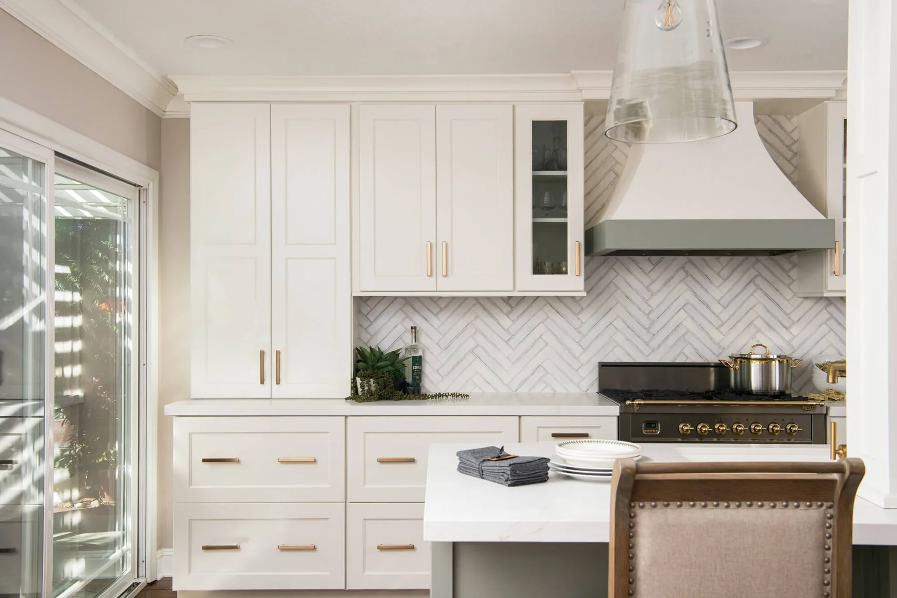 Floor-to-ceiling pantry cabinetry and integrated wine storage in a Gwinnett County kitchen remodel