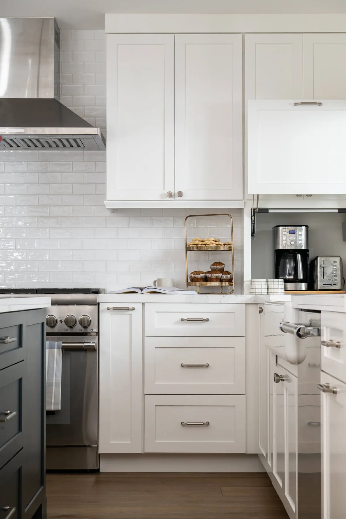 Compact kitchen remodel with a subway tile backsplash and stainless range near Loganville, GA