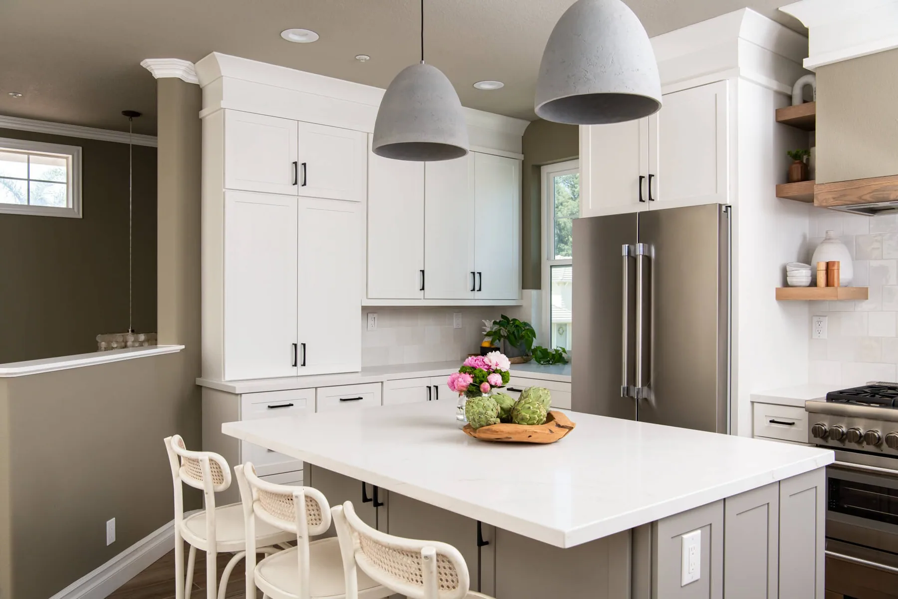 Floor-to-ceiling cabinetry and a panelled refrigerator in a Gwinnett County kitchen renovation